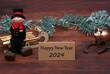 Happy New Year 2024: chimney sweep, lucky pig, horseshoe and a card with congratulations on the New Year.
