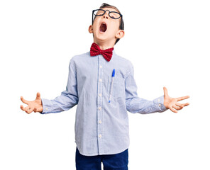 Wall Mural - Cute blond kid wearing nerd bow tie and glasses crazy and mad shouting and yelling with aggressive expression and arms raised. frustration concept.