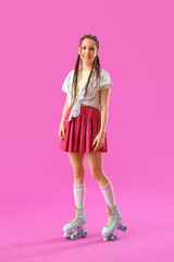 Wall Mural - Young woman with dreadlocks and roller skates on pink background