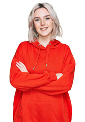 Sticker - Young blonde girl wearing casual clothes happy face smiling with crossed arms looking at the camera. positive person.