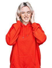 Canvas Print - Young blonde girl wearing casual clothes covering ears with fingers with annoyed expression for the noise of loud music. deaf concept.