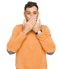 Canvas Print - Young hispanic man wearing casual clothes shocked covering mouth with hands for mistake. secret concept.