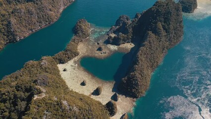 Sticker - Aerial view of the West Papua's seascape. Misool region with lots of islets and tropical lagoons in Raja Ampat, Indonesia