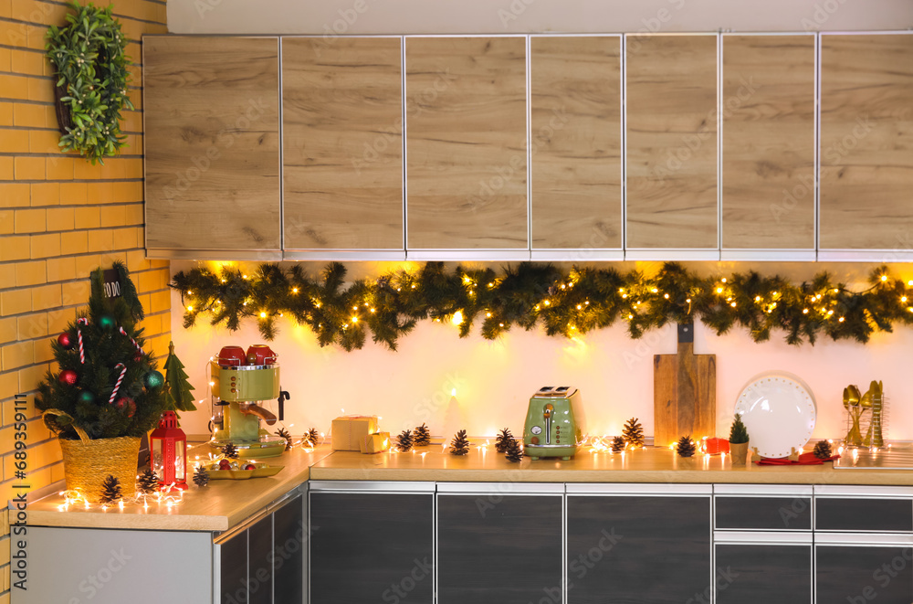 Interior of kitchen with counters, utensils and Christmas tree