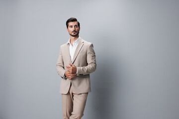 Wall Mural - copyspace man beige businessman studio happy handsome business suit smiling portrait