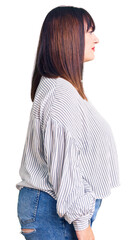 Sticker - Young plus size woman wearing casual clothes looking to side, relax profile pose with natural face with confident smile.