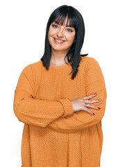 Wall Mural - Young hispanic woman wearing casual clothes happy face smiling with crossed arms looking at the camera. positive person.