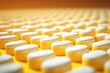 Pattern of yellow pills, a symbol of medical uniformity and pharmaceutical precision.