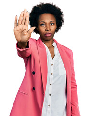 Poster - African american woman with afro hair wearing business jacket doing stop sing with palm of the hand. warning expression with negative and serious gesture on the face.