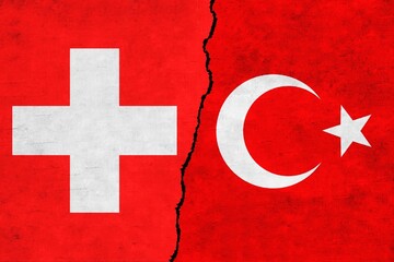 Turkey and Switzerland painted flags on a wall with a crack. Switzerland and Turkey relations.Turkey and Switzerland flags together