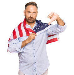 Sticker - Handsome middle age man holding united states flag with angry face, negative sign showing dislike with thumbs down, rejection concept