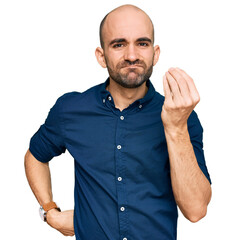 Wall Mural - Young hispanic man wearing casual clothes doing italian gesture with hand and fingers confident expression