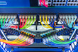 Network panel, switch and colorful cable in data center