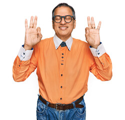 Poster - Middle age indian man wearing casual clothes and glasses relax and smiling with eyes closed doing meditation gesture with fingers. yoga concept.