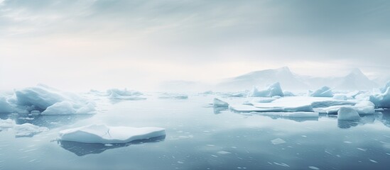 Wall Mural - frozen landscape in iceland with foggy weather, featuring blue icebergs drifting in calm ocean water