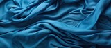 Fototapeta  - Crumpled, folded blue fleece backdrop.