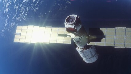 Wall Mural - the space module is flying in space in the orbit of the planet