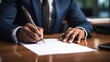 © ffunn - Businessman signing a contract in office. Close-up of business man signing contrac