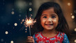 Little girl holding a sparkler in celebration of new year