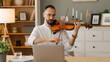 © Stockphotodirectors - Online violin lessons with male music teacher