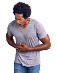 Sticker - Handsome african american man with afro hair wearing casual clothes with hand on stomach because nausea, painful disease feeling unwell. ache concept.