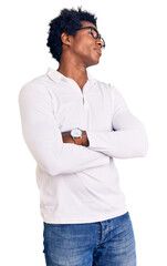 Poster - Handsome african american man with afro hair wearing casual clothes and glasses looking to the side with arms crossed convinced and confident