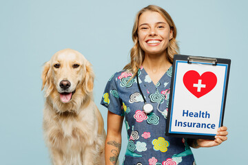 Wall Mural - Young fun veterinarian woman wear uniform stethoscope heal exam hug embrace retriever dog hold health insurance document isolated on plain blue background studio portrait. Take care about pet concept