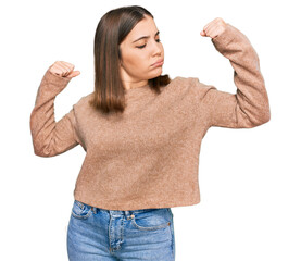 Sticker - Young beautiful woman wearing casual clothes showing arms muscles smiling proud. fitness concept.