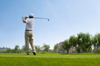 © Blue Jean Images - Male golfer swinging club