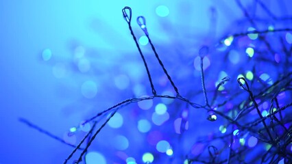 Wall Mural - christmas and new year blue color garland decoration background with colourful blinking lights. glow