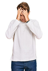 Wall Mural - Handsome caucasian man wearing casual white sweater suffering from headache desperate and stressed because pain and migraine. hands on head.