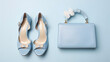 Cute blue ladies bag and stylish golden shoes. Flat