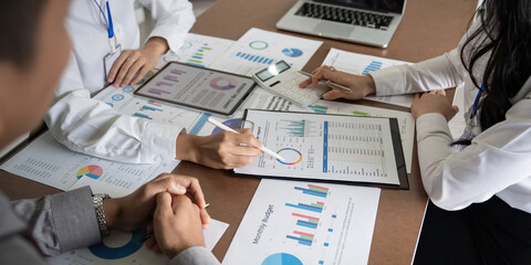 Wall Mural - Business team employee adviser meeting to analysis and discuss the situation on the financial report in the meeting room. Investment Consultant, Financial advisor and accounting concept