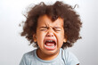 Cute little baby mixed race, afro american crying and screaming isolated on white background. Close up. Sad and in pain.