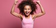 Young girl in pink workout wear demonstrating her workout moves on pink background