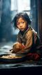 Asian children with malnutrition, looking weak and helpless, near metal bowl of food from volunteers