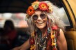 © Ari - An elderly hippie woman wearing a colorful wreath of flowers and numerous necklaces sits in the back seat of a car.