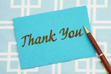 Wall Mural - Thank you greeting blue card and pen with squares