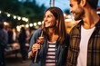 a couple sharing a skewer at an outdoor event