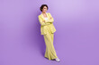 © deagreez - Full length photo of confident charming woman dressed yellow jacket arms crossed isolated purple color background