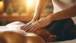Women's hands make a therapeutic neck massage for a girl lying on a massage couch in a massage spa salon. 