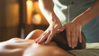 Woman`s hands make a therapeutic neck massage for a girl lying on a massage couch in a massage spa salon. Close up. 