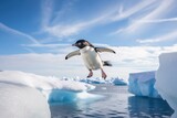 A penguin flying over an iceberg in the ocean