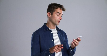 Poster - Man, typing and phone call in studio with smile for conversation, communication or networking. Person, smartphone and scroll with happiness for discussion, talking or texting on gray background