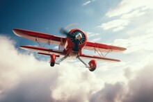 A Small Red Airplane Soaring Through A Cloudy Sky. Perfect For Aviation Enthusiasts And Travel-related Designs