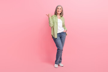 Poster - Full length photo of lovely satisfied lady wear stylish clothes presenting empty space store mall center isolated on pink color background