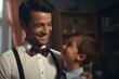 A heartwarming moment captured as a man in a bow tie and suspenders embraces a young boy. Perfect for family, love, and bonding concepts