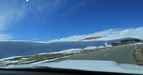 Wall Mural - Driving car on the high altitude road, China