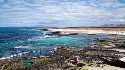 Wall Mural - Aerial view of Natural tidal pools of The Playa de los Charcos beach - Fuerteventura