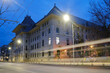 Bucharest town hall building exterior with car trail at twilight. Administration landmark in Romania capital city.